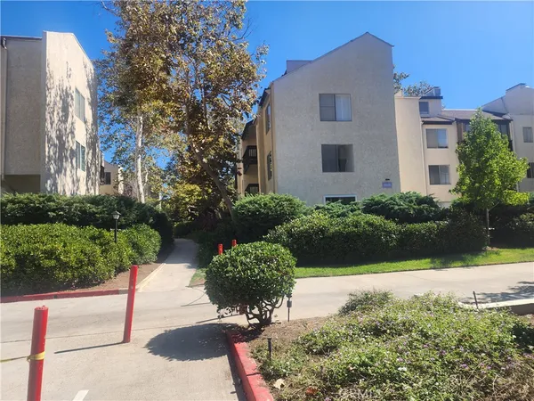a view of a garden with a pathway