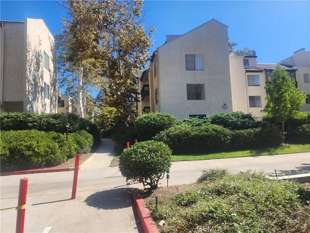a view of a garden with a pathway