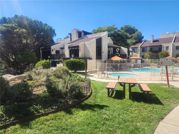 a view of living room with furniture and a window