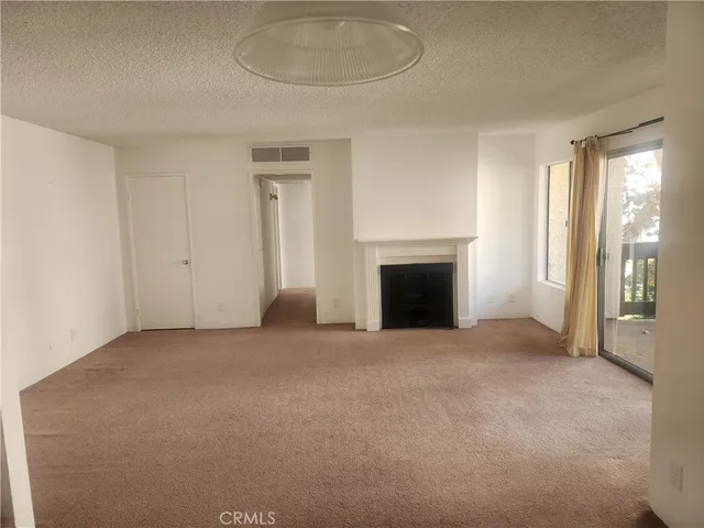 an empty room with fireplace