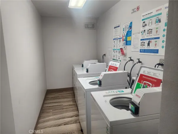 a view of parking garage with cars parked