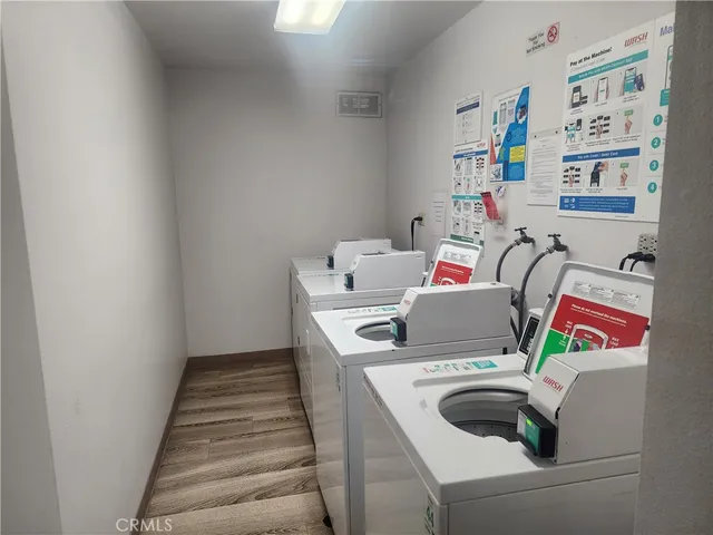 a view of parking garage with cars parked