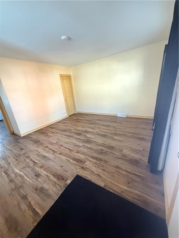 302 Neubert Street Kittanning, PA 16201 - Photo 18 of 23 a view of empty room with wooden floor