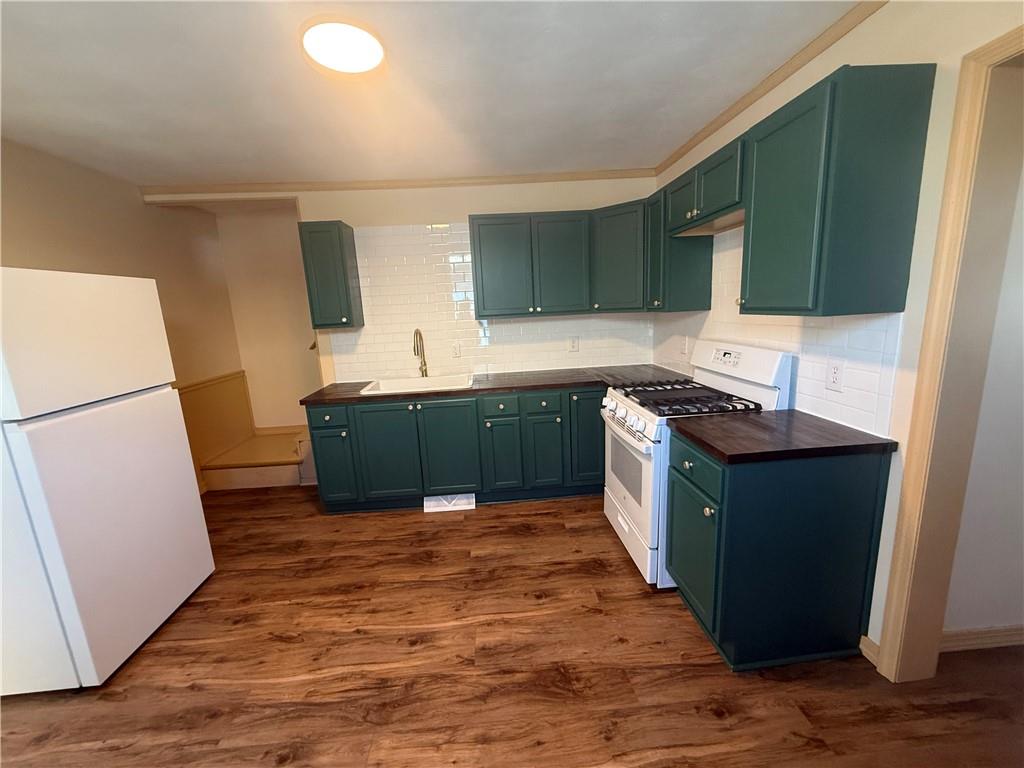 302 Neubert Street Kittanning, PA 16201 - Photo 2 of 23 a kitchen with a sink and a refrigerator