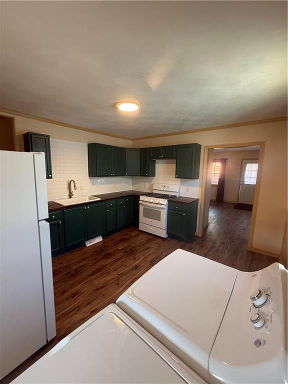 302 Neubert Street Kittanning, PA 16201 - Photo 7 of 23 a kitchen with a refrigerator and a stove top oven