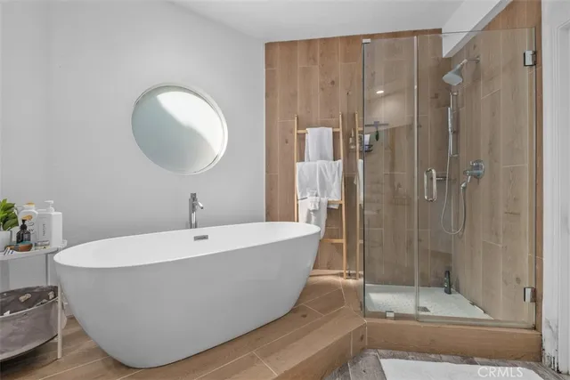 a bedroom with a bed and a television