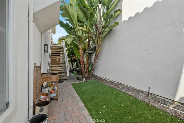 an aerial view of residential houses with city view