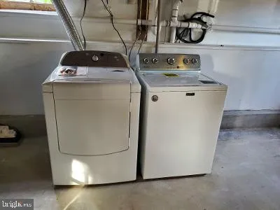 a bathroom with a tub and shower