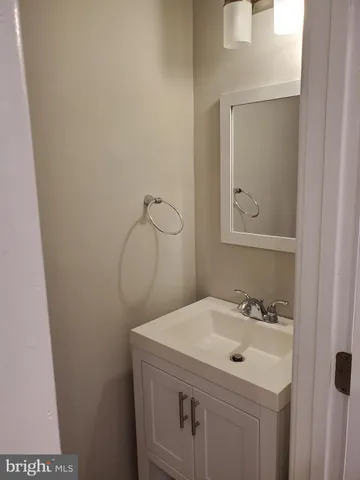 a bathroom with a sink and mirror