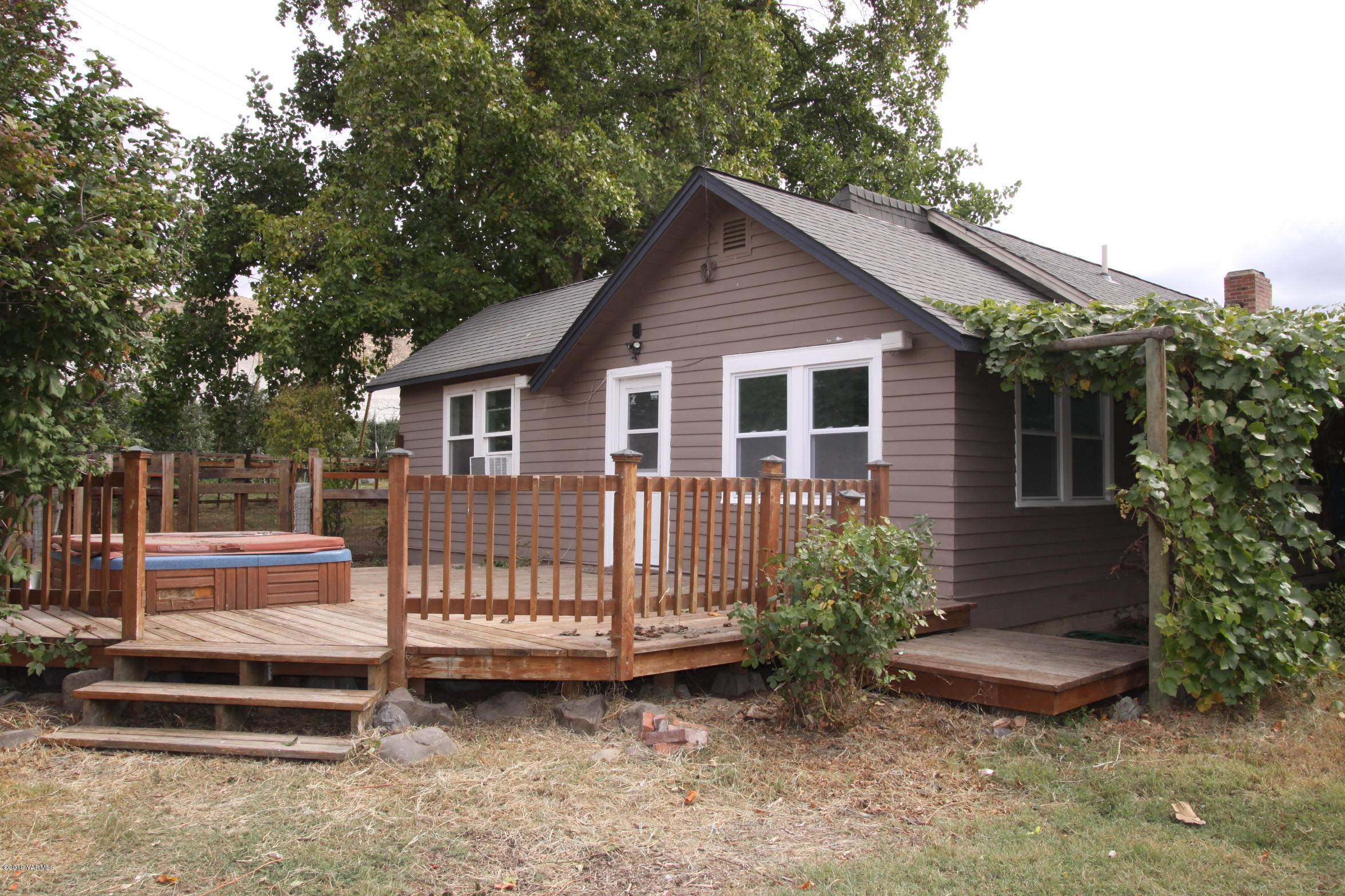 741 McPhee Road Naches, WA 98937 - Photo 13 of 16 a view of backyard with deck and outdoor seating