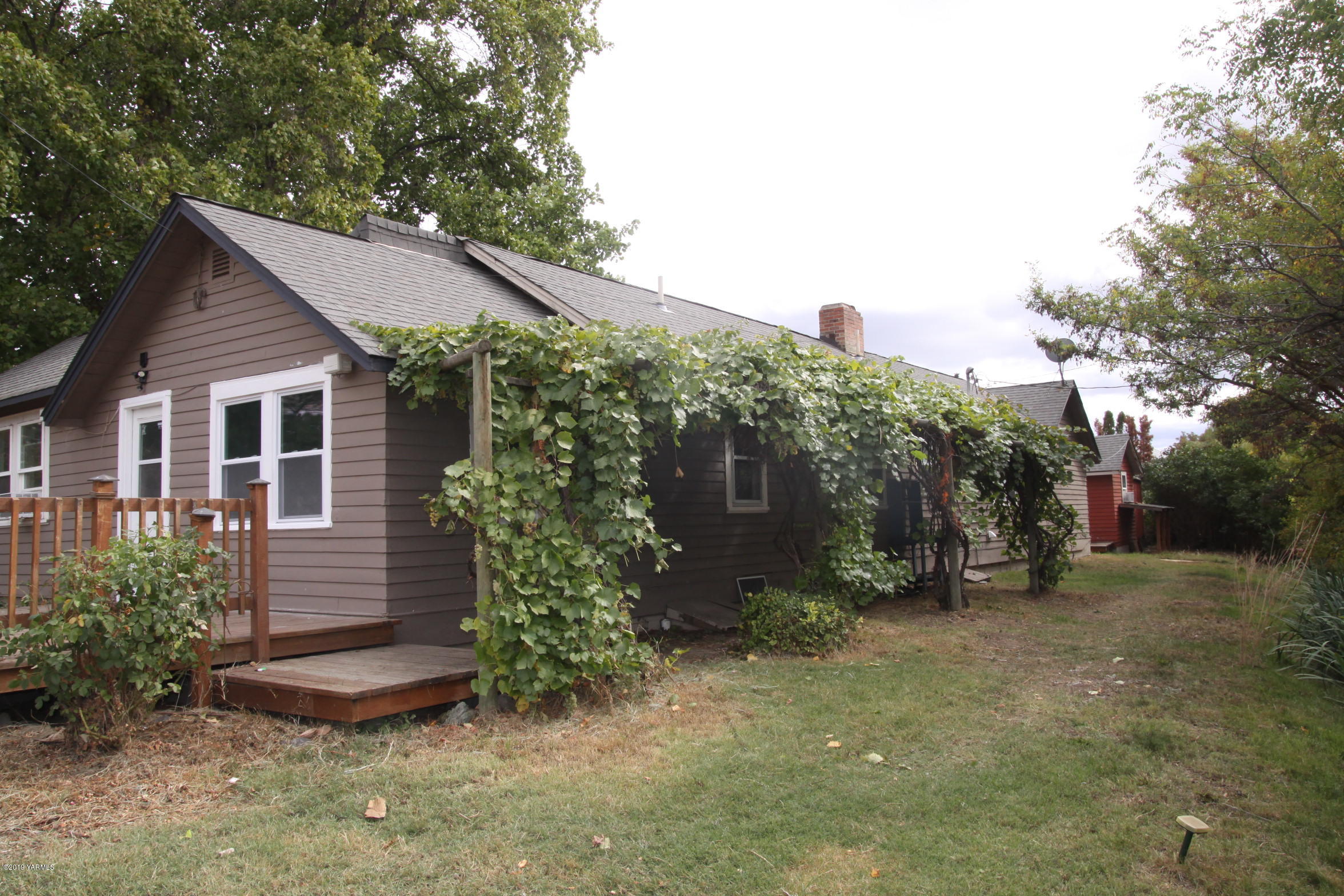 741 McPhee Road Naches, WA 98937 - Photo 15 of 16 a view of a house with a yard