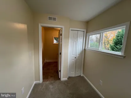 an empty room that has a window