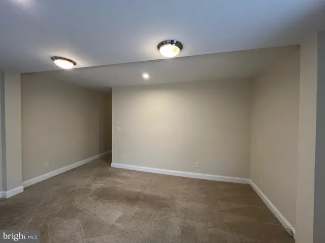 an empty room with a empty space and window