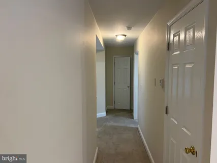 a view of a hallway with lamp