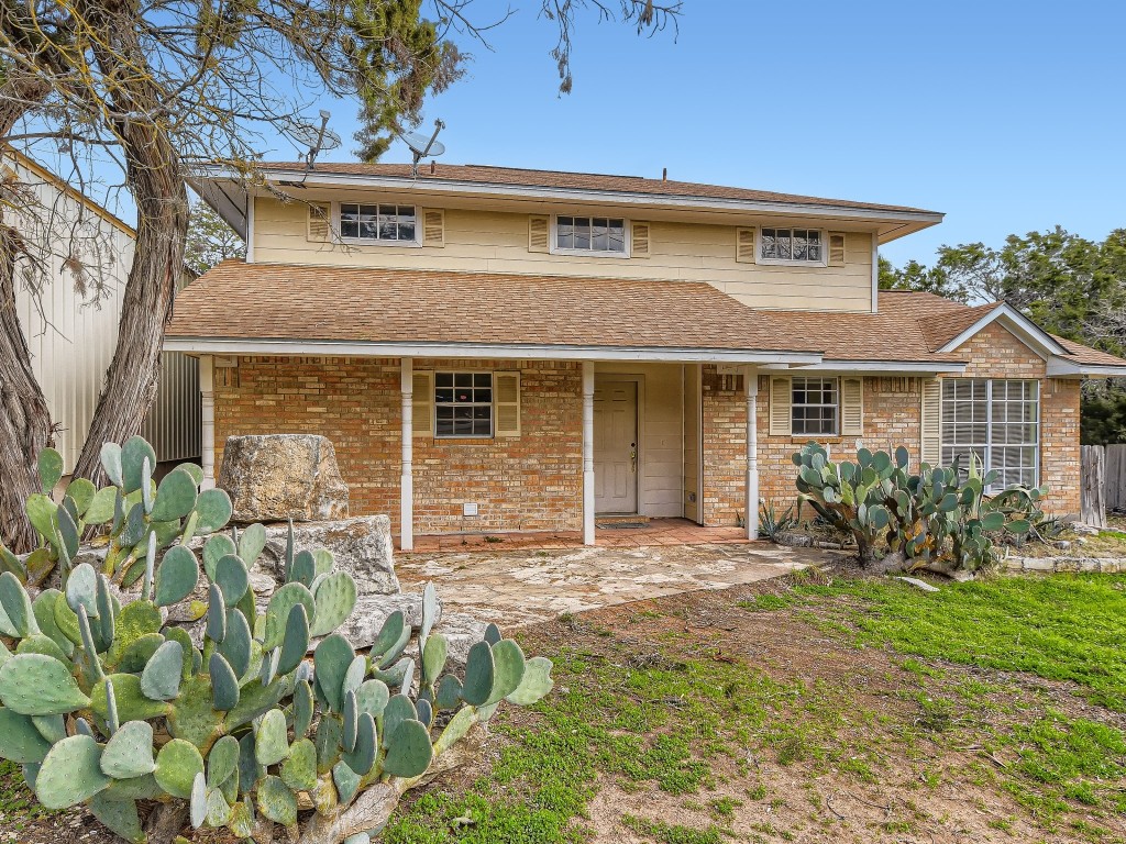 16306 Rocky Ridge Road Austin, TX 78734 - Photo 1 of 1 front view of a house with a yard