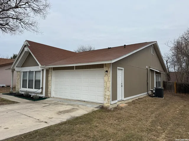 a backyard of a house with garage