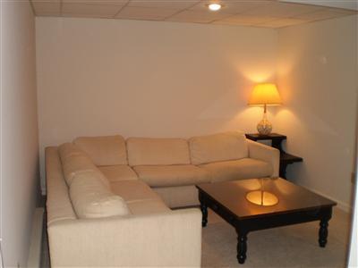 240 Cedric Road Centerville, MA 02632 - Photo 9 of 10 a living room with furniture and a lamp