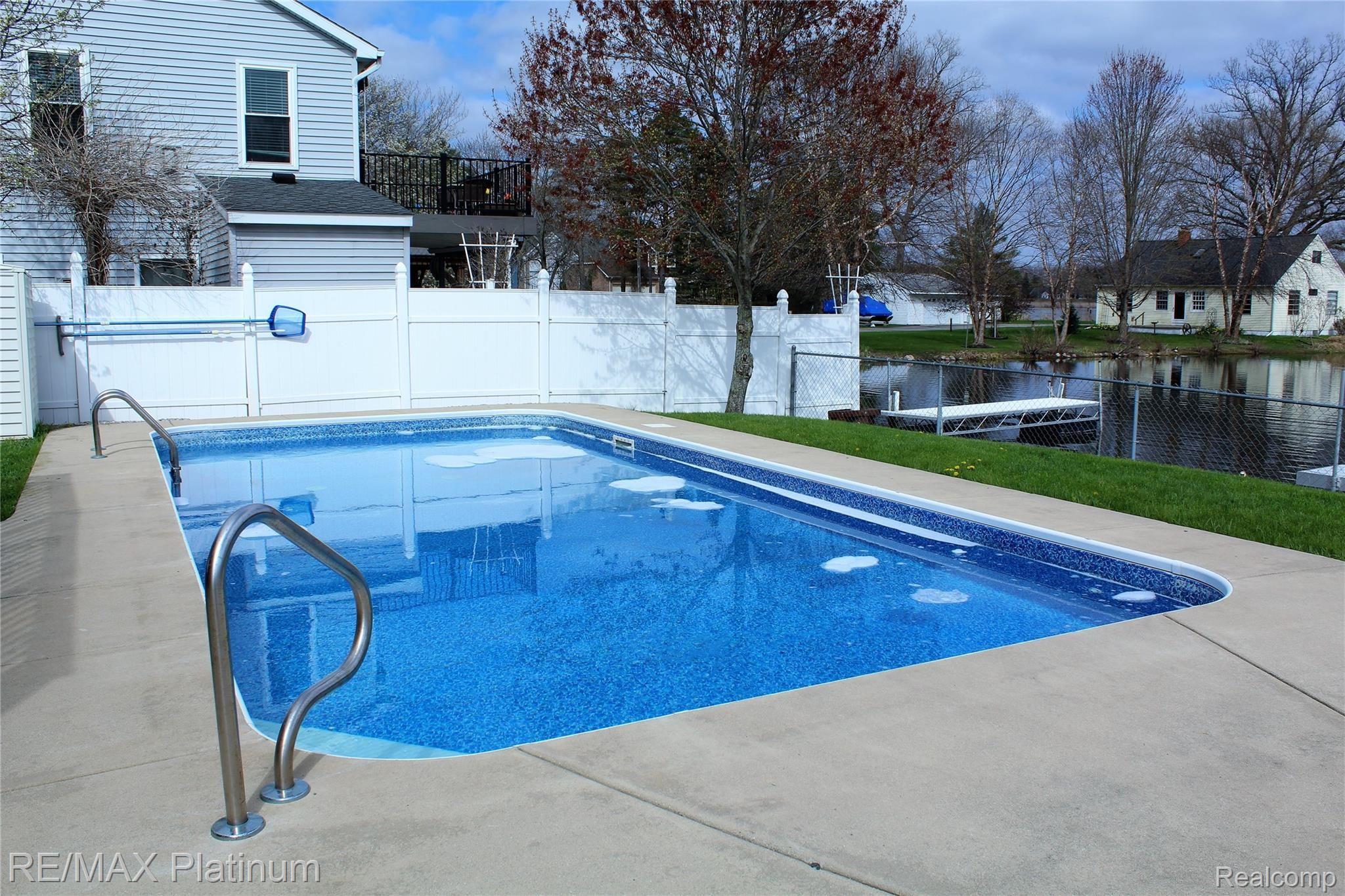 2678 Golf Club Road Howell, MI 48843 - Photo 3 of 46 Inviting pool overlooking the lake