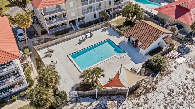 a view of a house with a yard and balcony