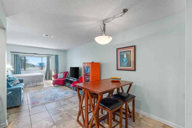 a kitchen with a refrigerator and a stove