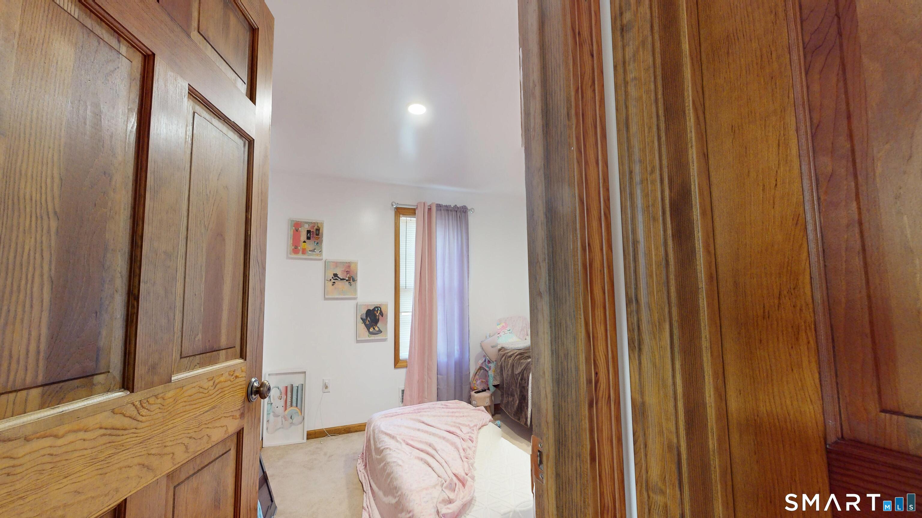 41 Mill Bridge Road Eastford, CT 06242 - Photo 15 of 39 a bedroom with a bed and a mirror