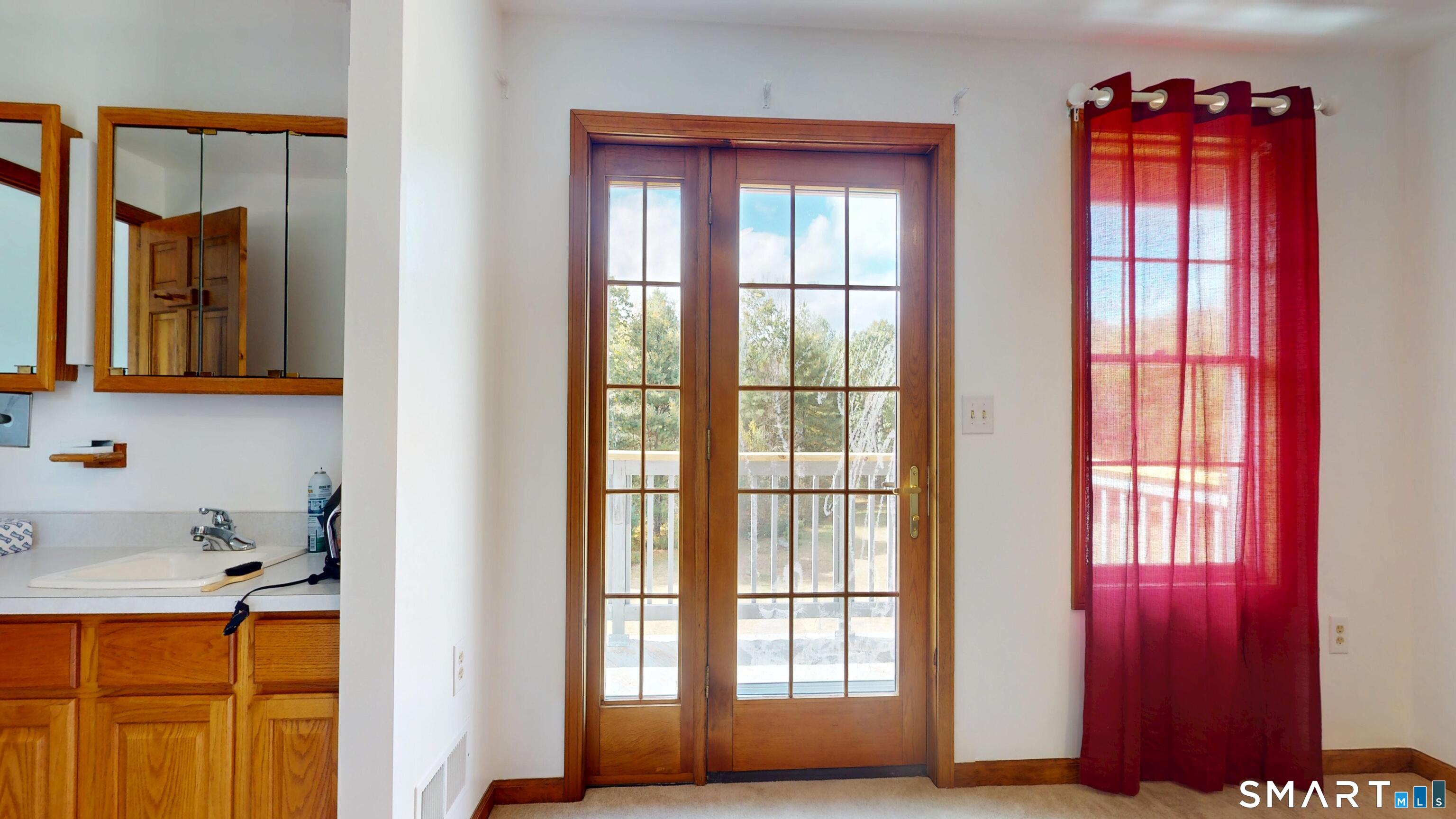 41 Mill Bridge Road Eastford, CT 06242 - Photo 19 of 39 a view of a bathroom with a window and a dresser