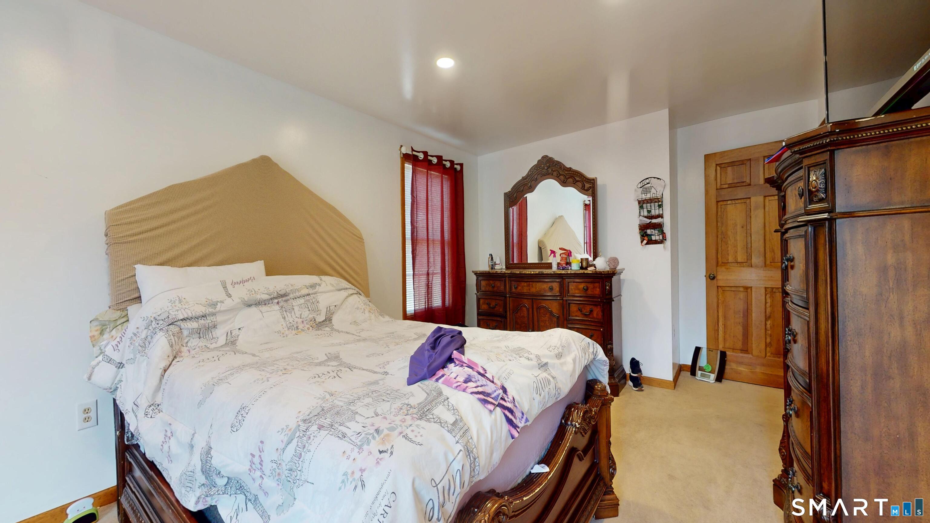 41 Mill Bridge Road Eastford, CT 06242 - Photo 20 of 39 a bedroom with a bed and a night stand