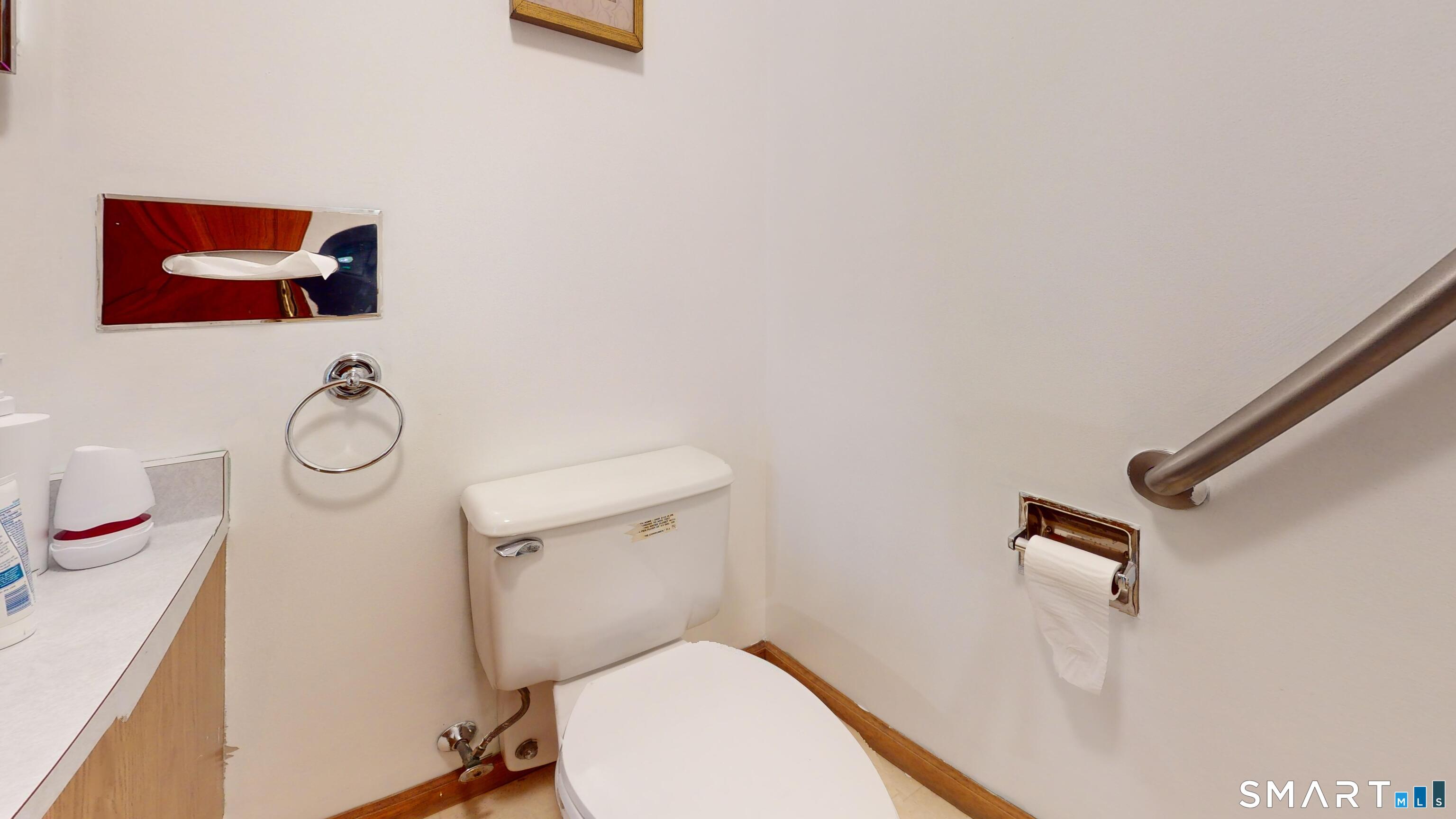 41 Mill Bridge Road Eastford, CT 06242 - Photo 23 of 39 a bathroom with a toilet and a shower curtain