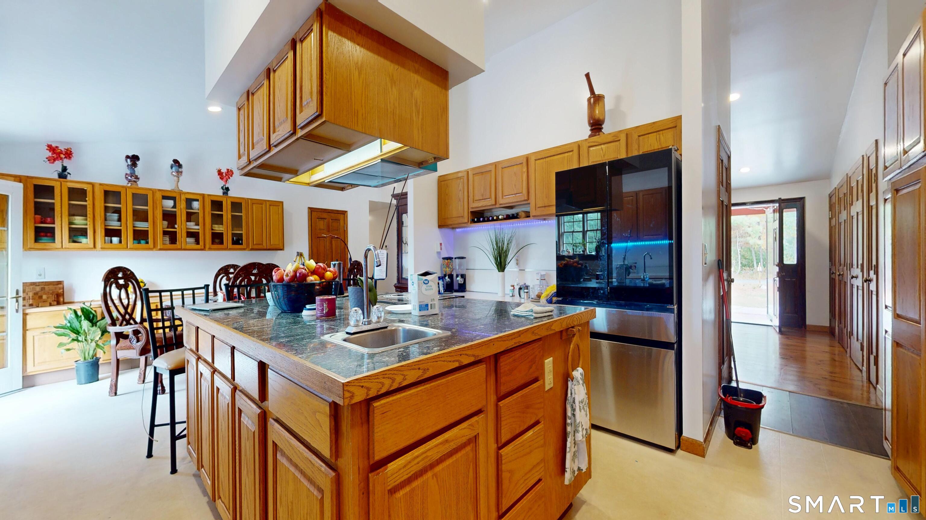 41 Mill Bridge Road Eastford, CT 06242 - Photo 29 of 39 a kitchen with stainless steel appliances granite countertop a sink and a refrigerator