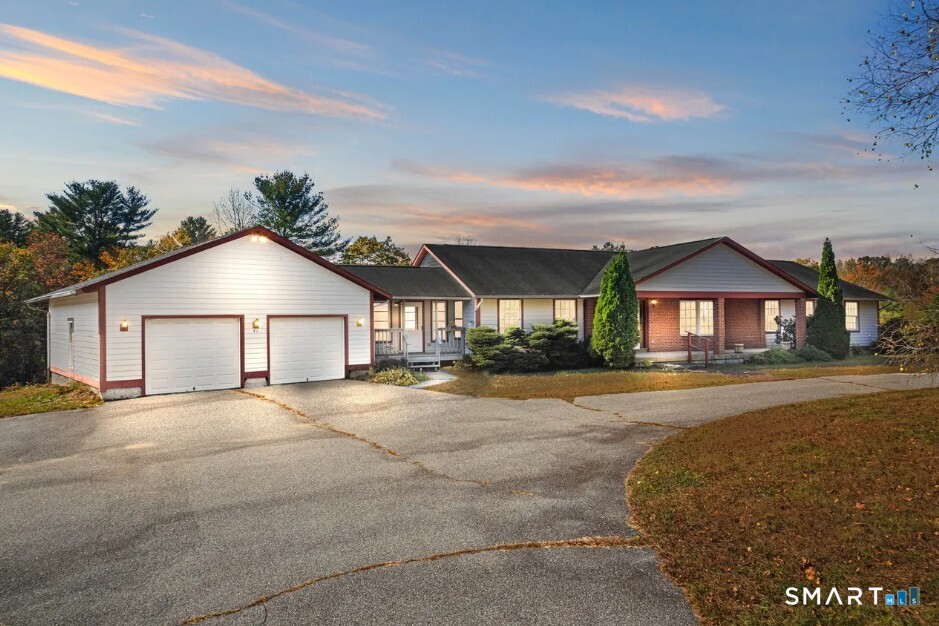 41 Mill Bridge Road Eastford, CT 06242 - Photo 34 of 39 a view of a house with a yard and garage
