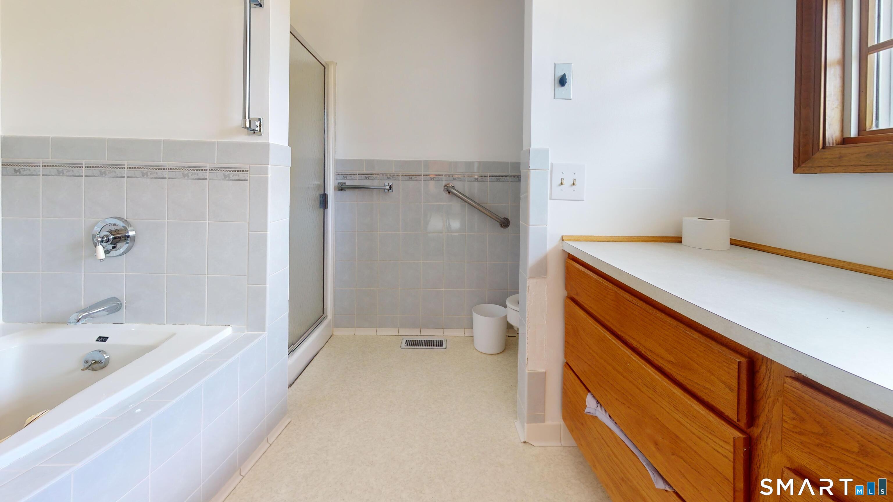 41 Mill Bridge Road Eastford, CT 06242 - Photo 36 of 39 a bathroom with a sink a toilet and shower