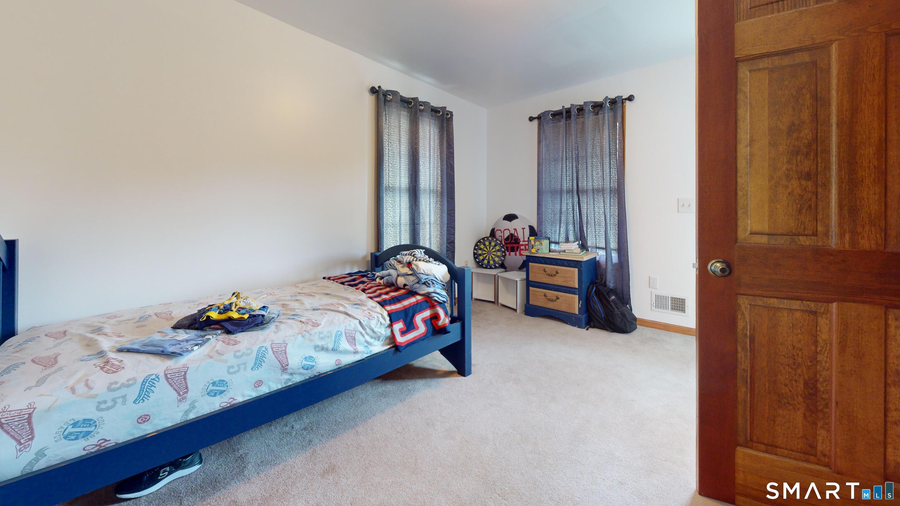 41 Mill Bridge Road Eastford, CT 06242 - Photo 39 of 39 a bed sitting in a bedroom next to a window