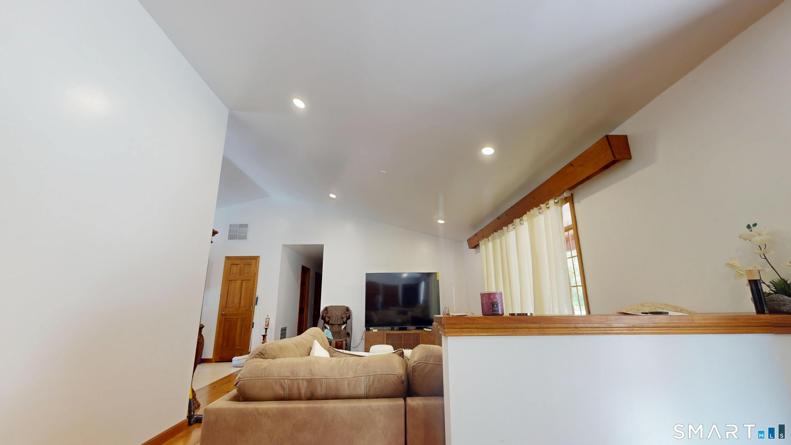41 Mill Bridge Road Eastford, CT 06242 - Photo 5 of 39 a living room with furniture and a flat screen tv