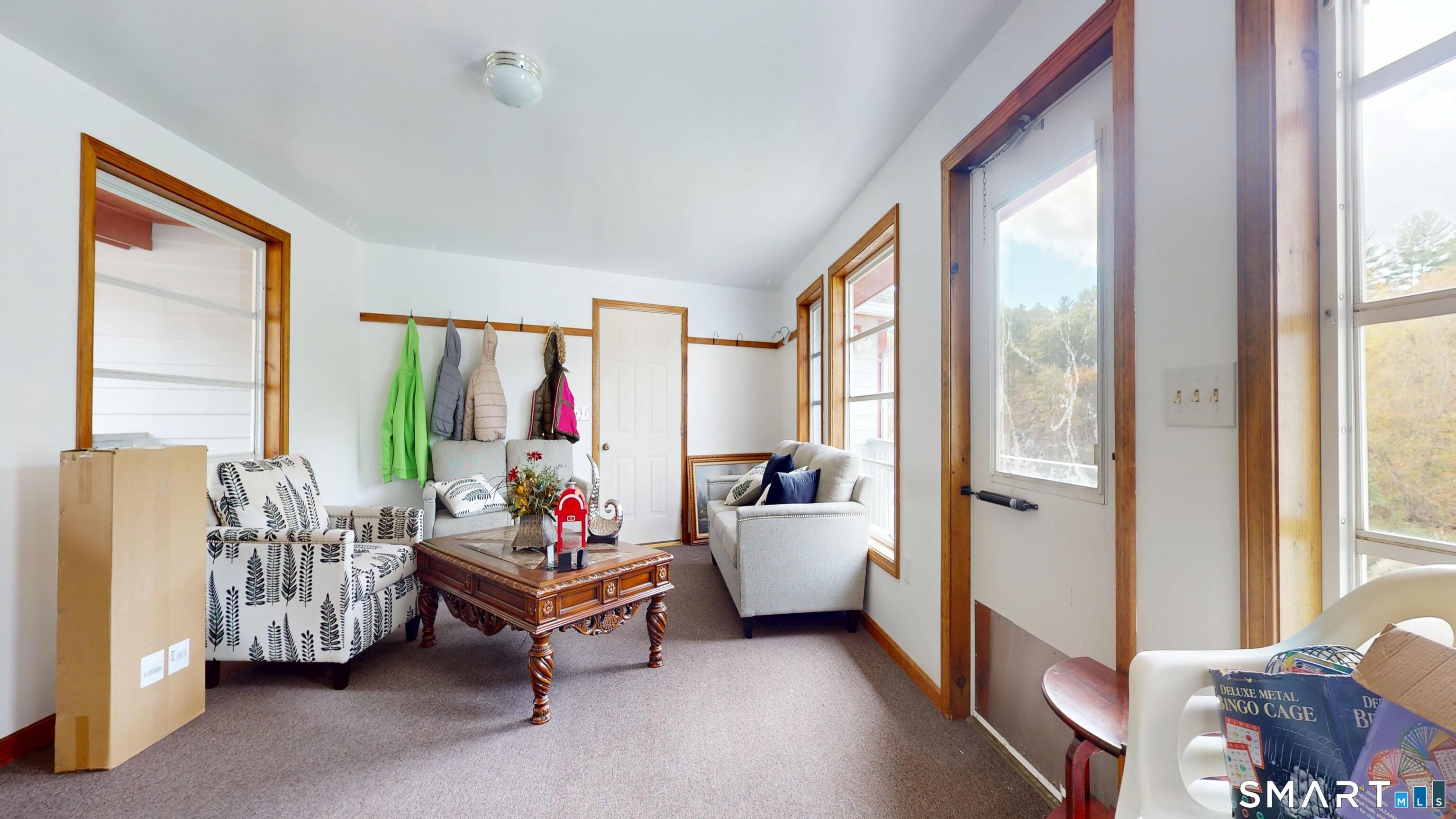 41 Mill Bridge Road Eastford, CT 06242 - Photo 7 of 39 a living room with furniture and a large window