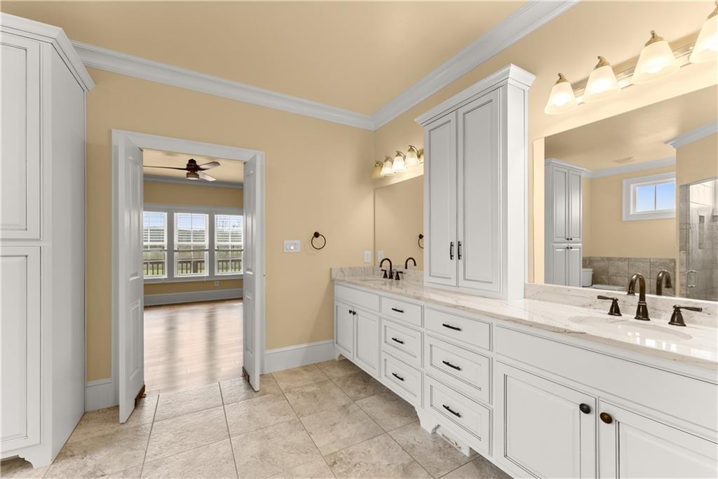 725 County Farm Road Jefferson, GA 30549 - Photo 28 of 66 a spacious bathroom with a double vanity sink and a mirror