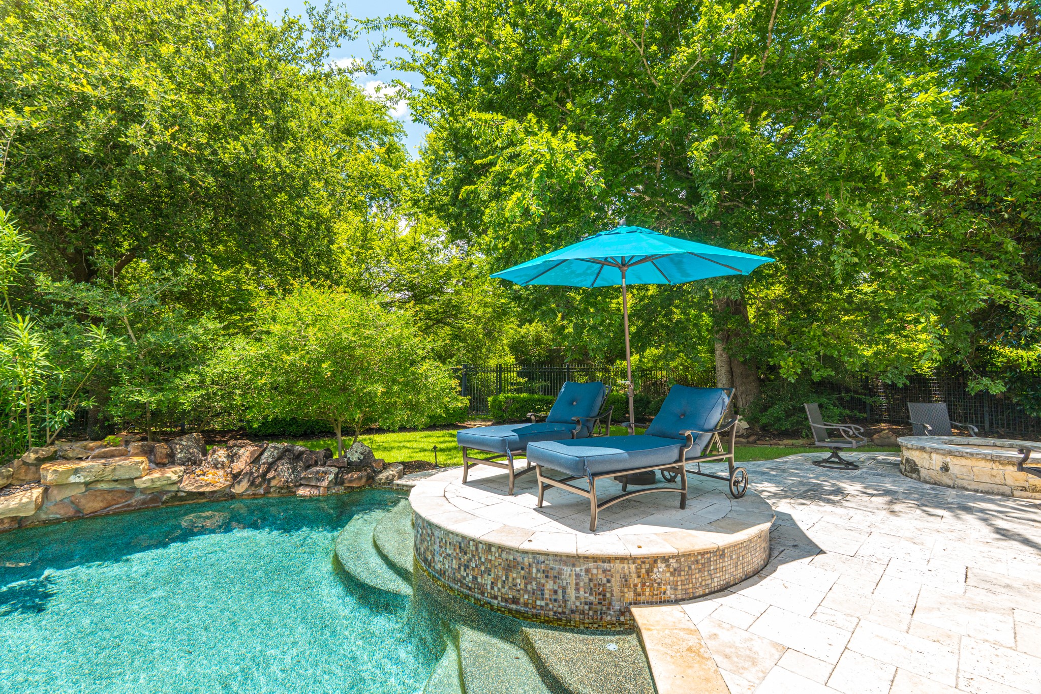 247 South Fazio Way Spring, TX 77389 - Photo 12 of 17 Every detail was thoughtfully designed to create an unmatched resort experience. Unwind in your own oasis, complete with a sun shelf, elegant lounge spaces, and thoughtfully designed landscaping creating a true resort atmosphere.