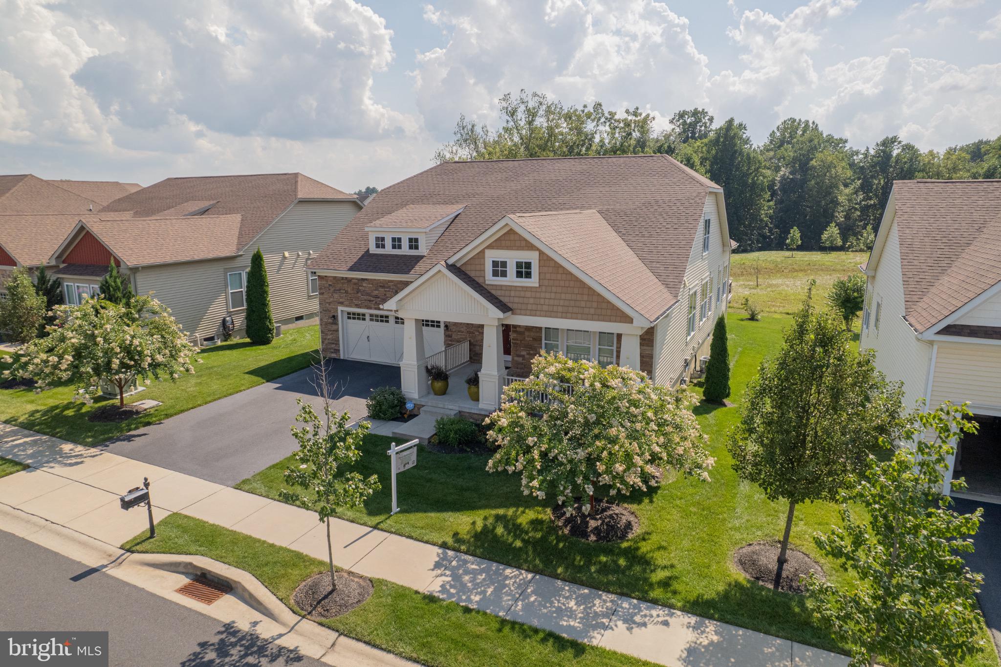 650 Vivaldi Drive Middletown, DE 19709 - Photo 1 of 36 Charming home with lush greenery and sky.