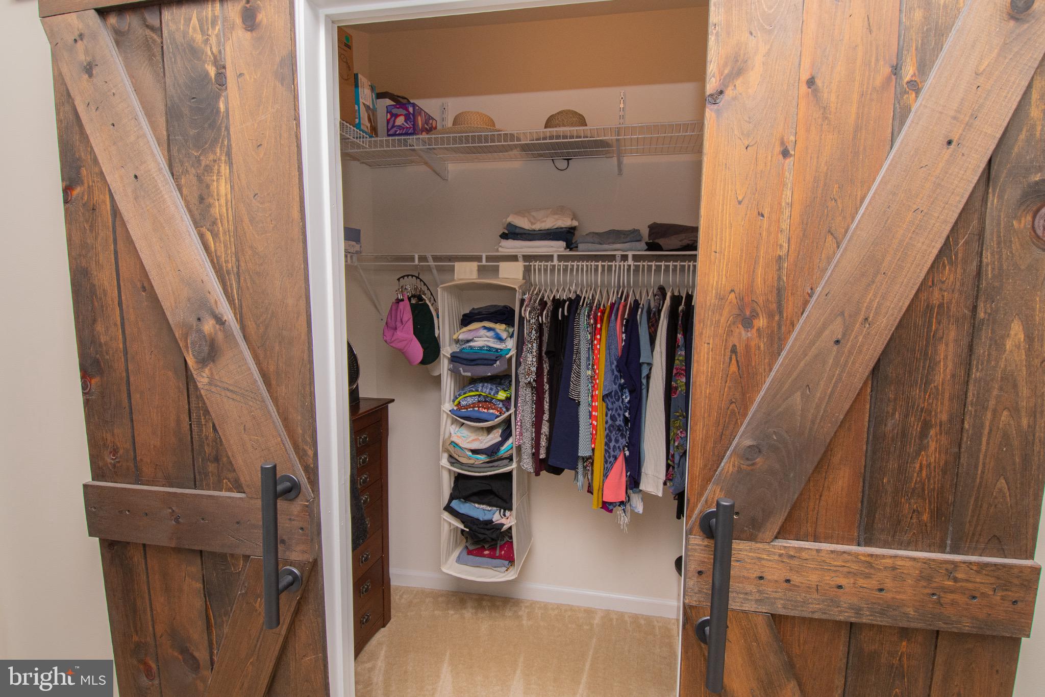 650 Vivaldi Drive Middletown, DE 19709 - Photo 21 of 36 Charming barn doors reveal organized closet space.