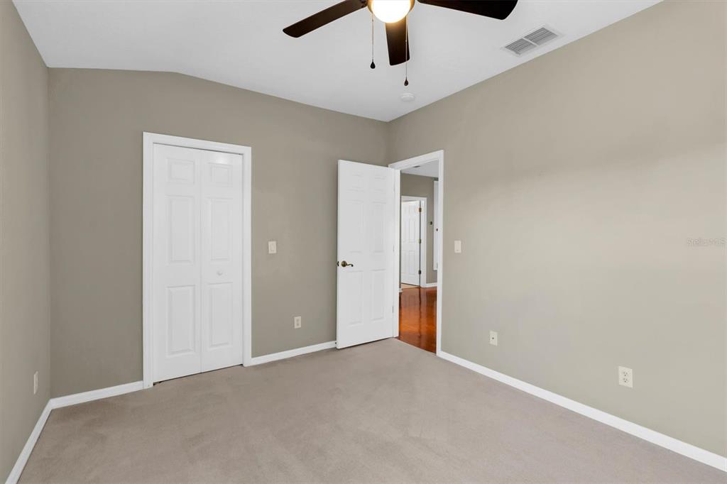 10121 Porch Street New Port Richey, FL 34655 - Photo 32 of 57 en empty room with ceiling fan and window