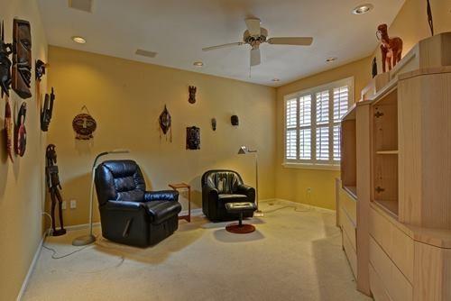 5156 Northwest 26th Circle Boca Raton, FL 33496 - Photo 11 of 18 a bedroom with a bed and a chair
