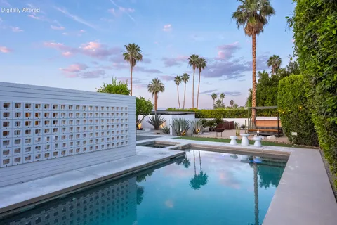 an aerial view of a house with yard swimming pool and outdoor seating