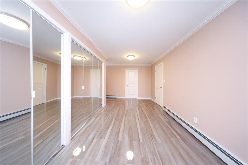 8756 26th Avenue Brooklyn, NY 11214 - Photo 18 of 26 wooden floor in an empty room