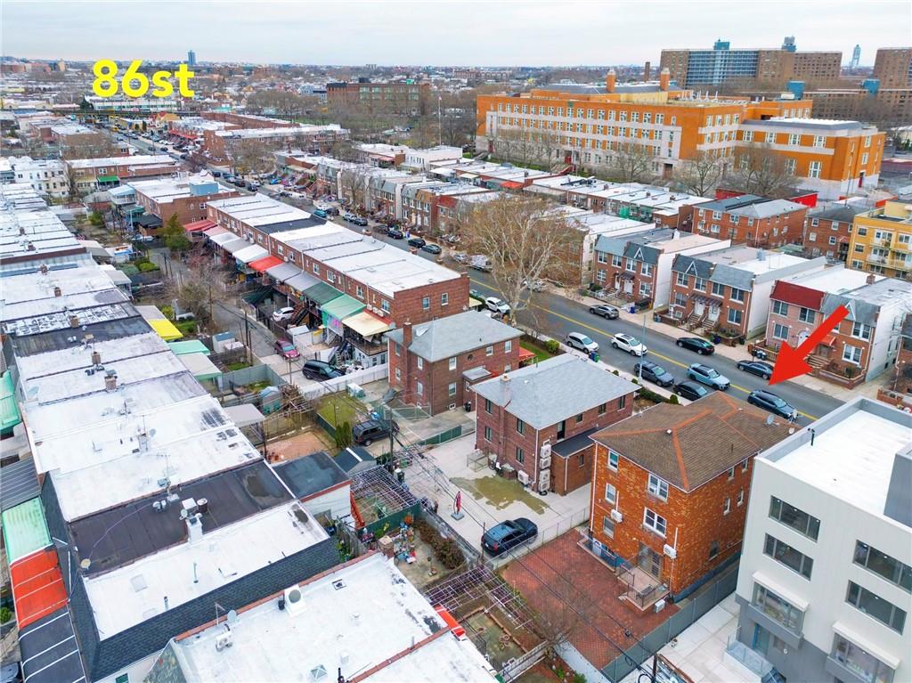 8756 26th Avenue Brooklyn, NY 11214 - Photo 25 of 26 an aerial view of a city with streets and houses