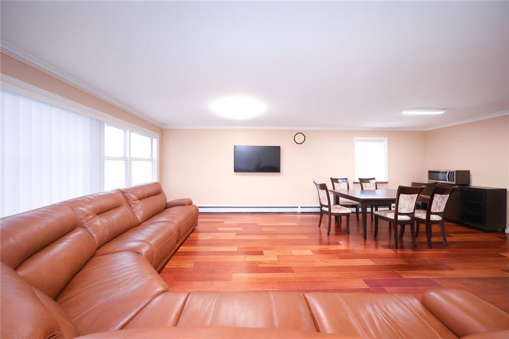 8756 26th Avenue Brooklyn, NY 11214 - Photo 5 of 26 a living room with furniture and a flat screen tv