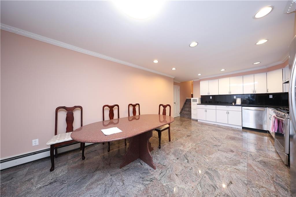 8756 26th Avenue Brooklyn, NY 11214 - Photo 10 of 26 a living room with furniture and a view of kitchen