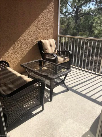 a view of balcony with wooden floor
