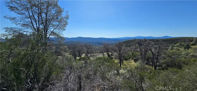 a view of a top of a house with a mountain in the background