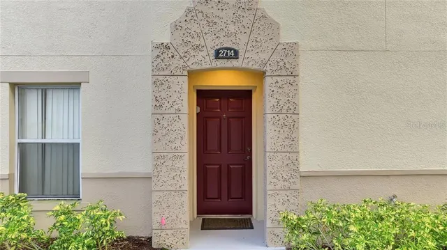 front view of a house with a window and a garage