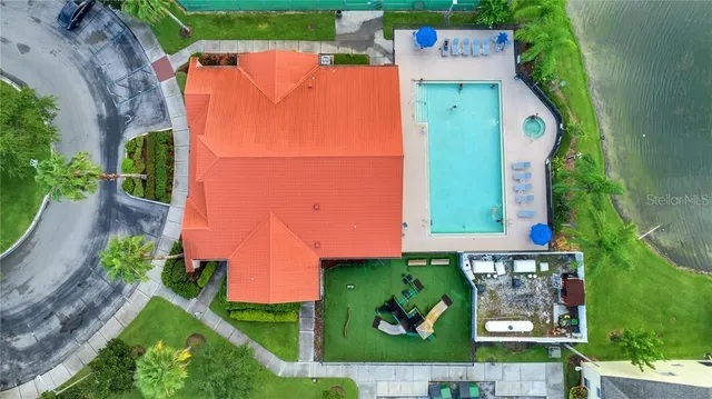 an aerial view of a house with garden space and street view