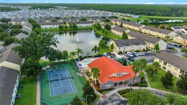 an aerial view of a house with a swimming pool yard and outdoor seating